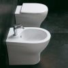 Floor-standing ceramic toilet and bidet cover included and with translated flush Amos model
