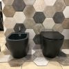 Pair of flush floor-standing ceramic sanitary ware in matte black color and soft-close coverwc Model ZENIT