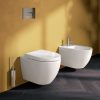 Wall-hung toilet and bidet including toilet seat covers made of polished white ceramic model "Virtus"